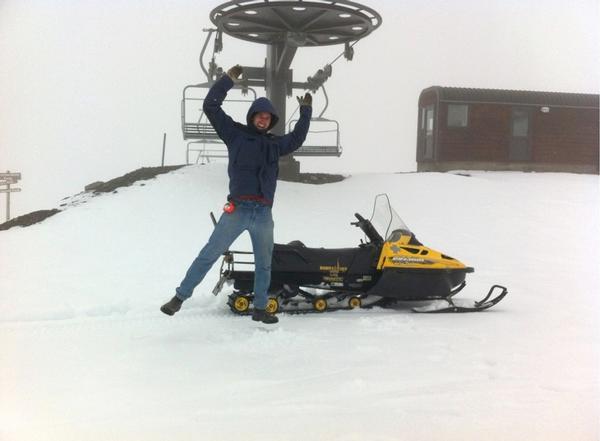 Mt Hutt electrician Rob Nesbitt jumps for joy in snow at the top of the Quad Chair.
